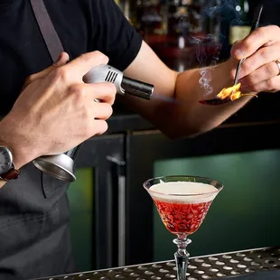 a bartender making a cocktail