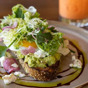 Avocado Toast (V) - sunny side up eggs, radish, pickled shallots crows dairy peppered feta