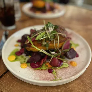 a plate of food on a wooden table