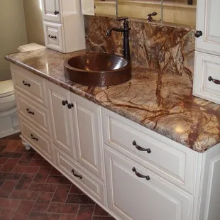 a bathroom with a marble counter top
