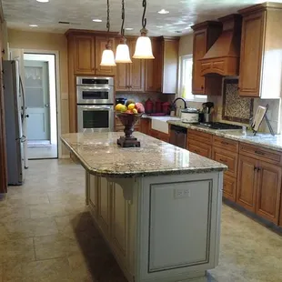 a large kitchen with a center island