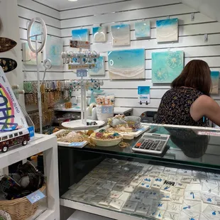 Register area along with Sarah Caudle pieces in the back, as of 6/26/2023