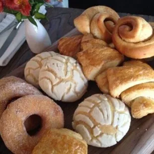 a variety of pastries on a cutting board