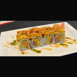 Sushi, tamal, pork, plantain crispy onions chimichurry sauce