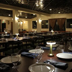 a dining room with tables and chairs