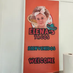 Photo of sign in and on outside of restaurant