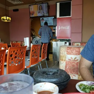 a man sitting at a table with food