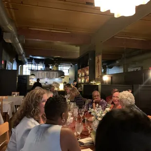 a group of people sitting at a table