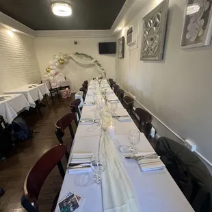 a long table with white linens