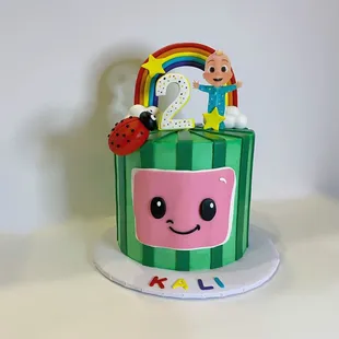 a cake with a rainbow on top