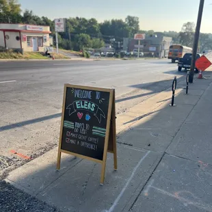 a sign on a sidewalk
