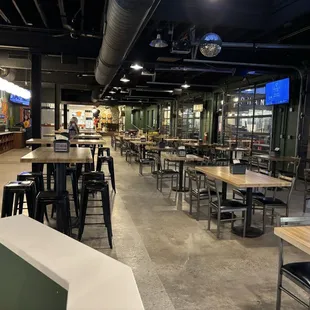 Huge seating area with tons of beer/wine/seltzer on draft