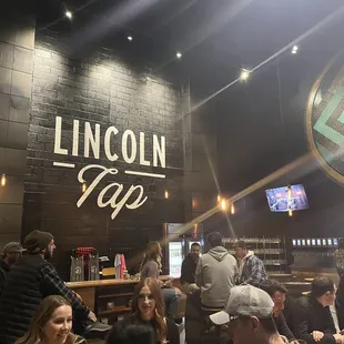 a large group of people in a bar