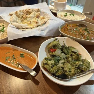 Mango chicken curry, hariali chicken kebabs, spicy masala sauce, garlic naan