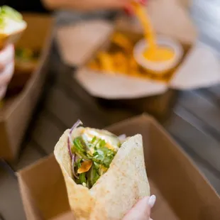 a person eating a burrito