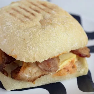 Eggs, bacon, and Tillamook cheddar cheese with creamy Cholula sauce on ciabatta