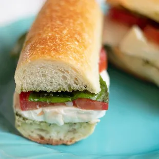 Northern Italian sandwich with tomatoes, fresh mozzarella, basil, and basil oil.