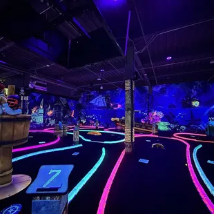 Indoor glow in the dark mini golf
