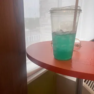 a cup of water on a table