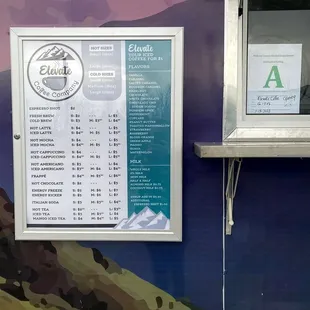 a menu on the side of a food truck