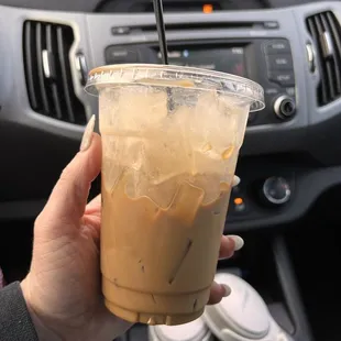 16 oz iced white chocolate americano with oat milk (half the flavor, quad shot)