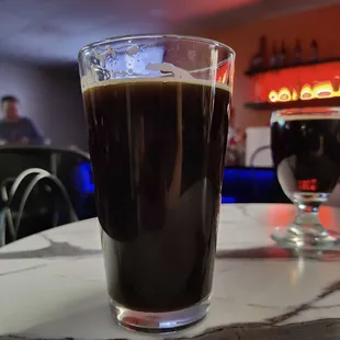 two glasses of coffee on a table