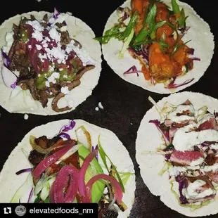 four tacos on a table