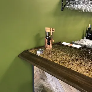 a bar with wine glasses on it