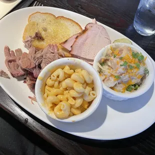 Split plate platter with pulled pork and smoked Turkey. Mac and cheese and loaded mashed potatoes