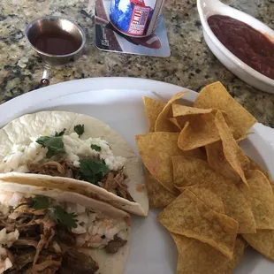 Pork tacos come 3 to an order w/ chips and salsa. I already scarfed one down!