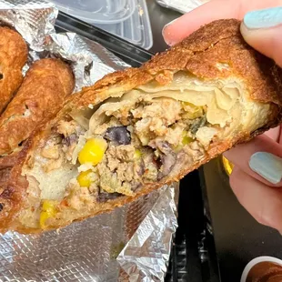  a person holding a sandwich