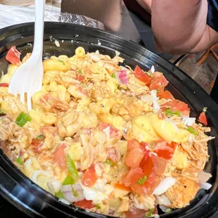  a bowl of food with a fork in it