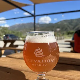 a glass of beer on a table