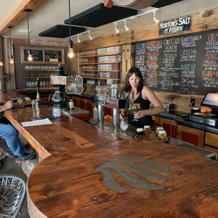 a man and a woman sitting at a bar