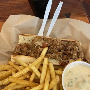 Chicken "cheesesteak" with fries and green chili beer cheese.