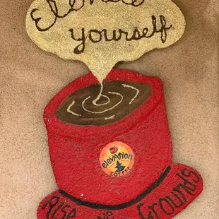 a cup of coffee with a sign above it