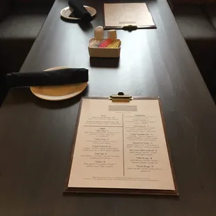 a man sitting at a table with a menu