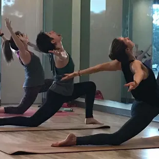 Low lunge hamstring stretch with back bend in one of our hot classes!