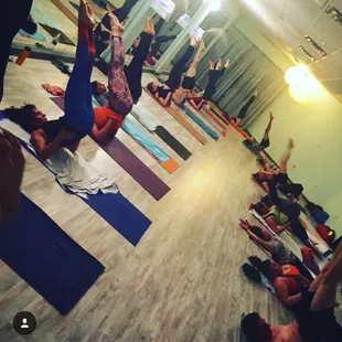 Kellie's 6:30pm Hot Yoga on Thursday practicing their shoulder stand to reverse rabbit!