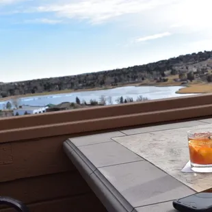 Old fashion overlooking the lake and mountains.