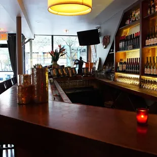 a bar with a lot of bottles of wine