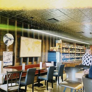 a man sitting at a table in a restaurant