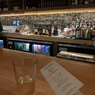 a glass of water on a bar counter