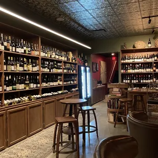 a wine shop with shelves full of bottles of wine