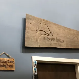 a wooden sign on the wall