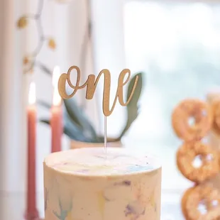 a cake with a one on top