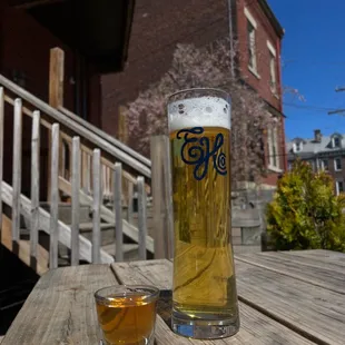 two glasses of beer on a wooden table