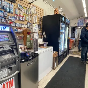 a man standing in front of an atm machine