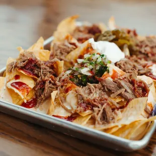 a plate of nachos on a table