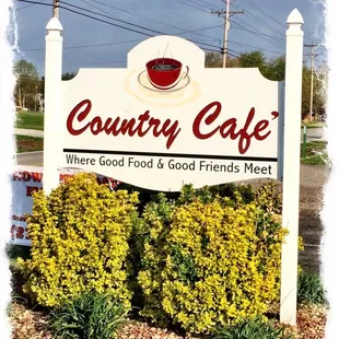 a sign with a cup of coffee